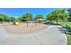 Well-maintained playground with slides, climbing structures, and seating, set in a lush park environment at 11580 N 86Th Ln, Peoria, AZ 85345