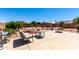 Relaxing backyard featuring desert landscaping, patio, seating and decorative features at 11631 W Lemon Ct, Surprise, AZ 85378