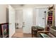 Bedroom view featuring a doorway and bright window with vertical blinds at 11631 W Lemon Ct, Surprise, AZ 85378