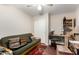 Bedroom area with comfortable futon, desk, and large closet for ample storage at 11631 W Lemon Ct, Surprise, AZ 85378