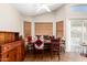Dining area featuring natural light, wood-look floors, and neutral paint at 11631 W Lemon Ct, Surprise, AZ 85378