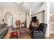 Bright living room featuring vaulted ceilings, wood-look floors, and neutral paint at 11631 W Lemon Ct, Surprise, AZ 85378