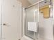 Bathroom shower featuring sliding glass door with tile surround at 11631 W Lemon Ct, Surprise, AZ 85378