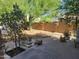 Secluded backyard with desert landscaping, a gravel ground cover, and potted plants at 1257 E Voltaire Ave, Phoenix, AZ 85022