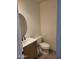 Stylish half-bathroom featuring modern vanity, round mirror, and sleek black faucet at 1257 E Voltaire Ave, Phoenix, AZ 85022