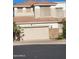 Inviting two-story home with a two-car garage and a well-maintained yard with desert landscaping at 1257 E Voltaire Ave, Phoenix, AZ 85022