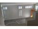 Bright, open living room features white walls and large windows at 1257 E Voltaire Ave, Phoenix, AZ 85022