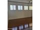 Bright living room features hardwood floors, white walls, and a ceiling fan at 1257 E Voltaire Ave, Phoenix, AZ 85022