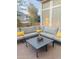 Relaxing outdoor patio with a comfortable sectional couch and modern coffee table at 1257 E Voltaire Ave, Phoenix, AZ 85022