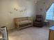 Bedroom with a crib, recliner, and calming decor at 1350 S Greenfield Rd # 1221, Mesa, AZ 85206