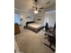 Bedroom with neutral carpet, ceiling fan, and desk area at 1350 S Greenfield Rd # 1221, Mesa, AZ 85206