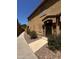 Charming home exterior with a walkway, decorative rock landscaping, and a stylish front entrance at 1350 S Greenfield Rd # 1221, Mesa, AZ 85206