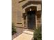 Stylish front door with a decorative sunburst design and stone accents for added curb appeal at 1350 S Greenfield Rd # 1221, Mesa, AZ 85206