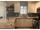 Kitchen features white cabinets, granite countertops, and a window above the sink at 1350 S Greenfield Rd # 1221, Mesa, AZ 85206