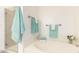 Bathroom featuring soaking tub, tiled shower, and decorative, matching towel sets at 14000 N 94Th St # 2187, Scottsdale, AZ 85260