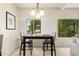 Bright dining area with a modern chandelier and seating for four at 14000 N 94Th St # 2187, Scottsdale, AZ 85260