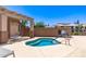 Community hot tub with tiled surround, a pergola, seating, and a pool rule sign at 14000 N 94Th St # 2187, Scottsdale, AZ 85260