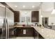 Modern kitchen features stainless steel appliances, granite countertops, and dark wood cabinetry at 14000 N 94Th St # 2187, Scottsdale, AZ 85260