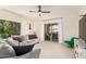 Inviting living room with plush seating, lots of light, and a ceiling fan at 14000 N 94Th St # 2187, Scottsdale, AZ 85260