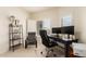 Well-lit home office features a desk, dual monitors, and ample storage at 14000 N 94Th St # 2187, Scottsdale, AZ 85260