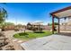 Backyard oasis with artificial turf, gazebo, hammock, patio, and seating area, perfect for outdoor entertaining at 15006 N 172Nd Ln, Surprise, AZ 85388