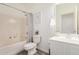 Clean bathroom with shower-tub combo, white vanity, mirror, and tasteful decorations at 15006 N 172Nd Ln, Surprise, AZ 85388