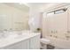 Well-lit bathroom featuring a shower-tub combo, white vanity, large mirror, and updated fixtures at 15006 N 172Nd Ln, Surprise, AZ 85388