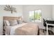 Cozy bedroom features a comfortable bed, tree wall decor, and a bright window view at 15006 N 172Nd Ln, Surprise, AZ 85388