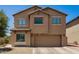 Charming two-story home with a well-maintained front yard and a spacious two-car garage at 15006 N 172Nd Ln, Surprise, AZ 85388