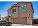This two-story home has a two-car garage and a neutral color scheme, located in a tranquil neighborhood at 15006 N 172Nd Ln, Surprise, AZ 85388