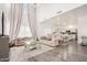 Open-concept living and dining area with elegant furnishings and soaring ceilings at 15006 N 172Nd Ln, Surprise, AZ 85388