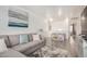 Spacious living room with a comfortable sectional sofa, modern decor, and plenty of room for Gathering activities at 15006 N 172Nd Ln, Surprise, AZ 85388