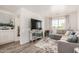 Inviting living room with a plush sectional sofa, mirrored console, and ample natural light, perfect for relaxing at 15006 N 172Nd Ln, Surprise, AZ 85388