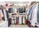 Organized walk-in closet with ample storage, multiple shelves, and plenty of hanging space at 15006 N 172Nd Ln, Surprise, AZ 85388