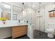 Modern bathroom featuring a stylish vanity with a vessel sink, frameless glass shower, and elegant marble-look tile at 16648 N 30Th Ave, Phoenix, AZ 85053