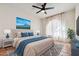 Bright bedroom with large bed, stylish rug, accent pillows, and sheer curtains for pleasant natural light at 16648 N 30Th Ave, Phoenix, AZ 85053
