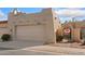 Exterior view of a one-story home with a two car garage, gate, and desert landscaping at 16648 N 30Th Ave, Phoenix, AZ 85053