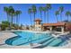 Stunning community pool and spa area, surrounded by lush landscaping and palm trees at 16648 N 30Th Ave, Phoenix, AZ 85053
