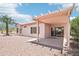 A covered patio and desert landscaping accentuate the backyard of this single Gathering home at 20234 N Mariposa Way, Surprise, AZ 85374