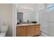 En-suite bathroom with a large mirror and glass enclosed shower at 20234 N Mariposa Way, Surprise, AZ 85374