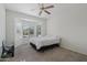 Bright bedroom with ceiling fan and large windows at 20234 N Mariposa Way, Surprise, AZ 85374