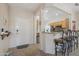 Inviting entryway flows seamlessly into the kitchen area, complete with barstool seating and ample space at 20234 N Mariposa Way, Surprise, AZ 85374