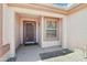 Inviting front porch with security door detail and shade offering a welcoming entrance at 20234 N Mariposa Way, Surprise, AZ 85374