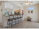 Stylish kitchen bar featuring granite counters, seating, and modern appliances for casual dining at 20234 N Mariposa Way, Surprise, AZ 85374