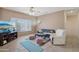 Comfortable living room offering tile floors, and a cozy sitting area bathed in natural light at 20234 N Mariposa Way, Surprise, AZ 85374
