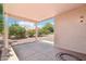The covered patio overlooks the beautiful backyard landscaping with desert plants and decorative rock at 20234 N Mariposa Way, Surprise, AZ 85374
