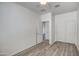 Bright bedroom with wood-look flooring, closet and ensuite bath at 20410 N Mac Neil St, Maricopa, AZ 85138