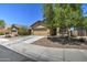 Single-Gathering home with desert landscaping, complemented by a concrete driveway leading to an attached garage at 20410 N Mac Neil St, Maricopa, AZ 85138