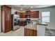 Well-equipped kitchen with granite counters, stainless steel appliances, and plenty of cabinet space for storage at 20410 N Mac Neil St, Maricopa, AZ 85138