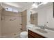 Clean bathroom with tile shower, grab bar, toilet, and vanity at 2650 W Union Hills Dr # 215, Phoenix, AZ 85027
